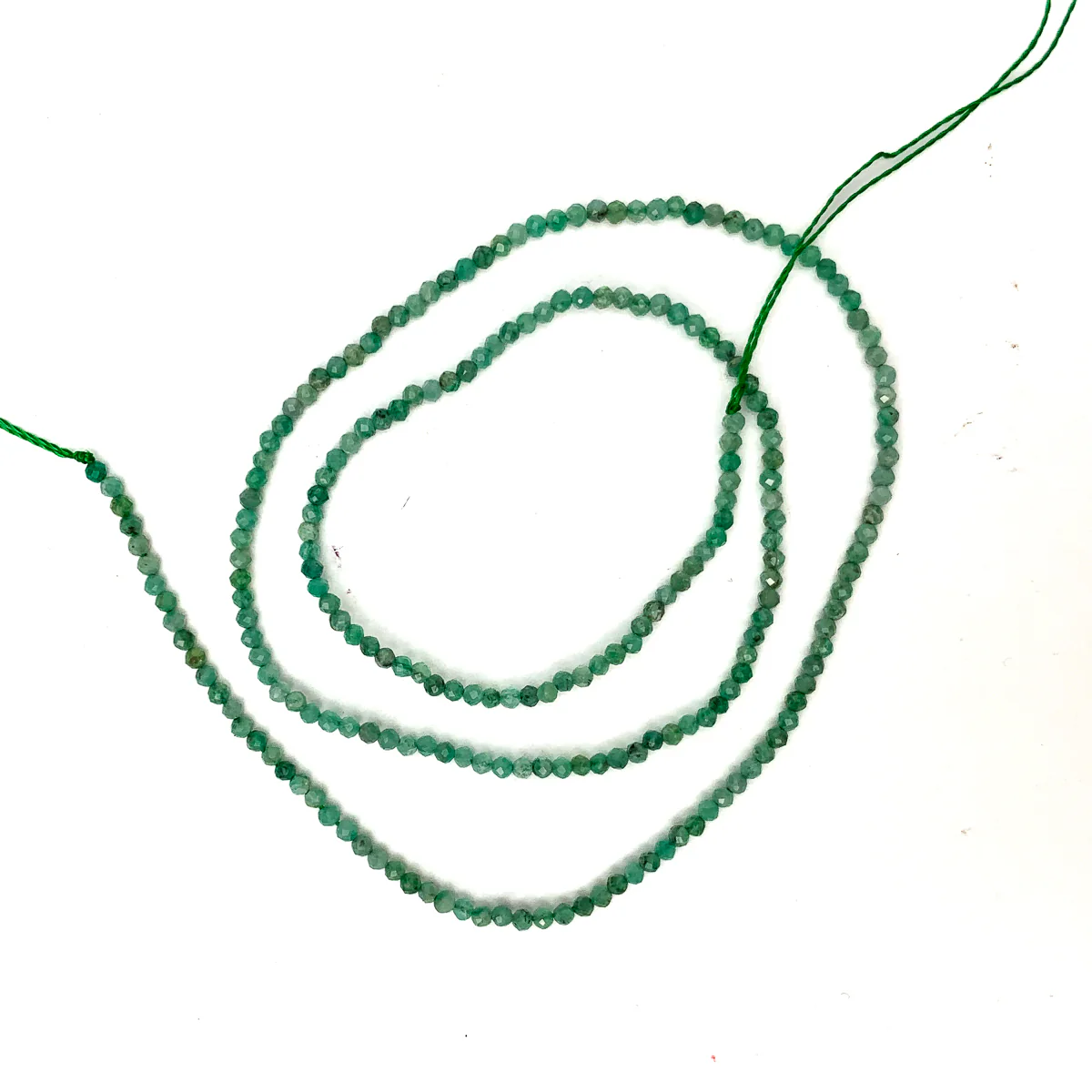 Emerald Columbia 2mm Faceted Rounds - Image 2
